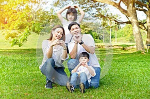 Outdoor portrait of asian family