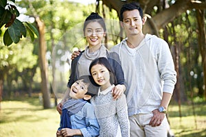 Outdoor portrait of asian family