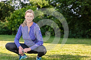 Outdoor Portrait of Attractive Middle Aged Woman Exercising