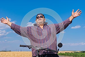 Outdoor portrait of a bearded, chubby senior man being happy