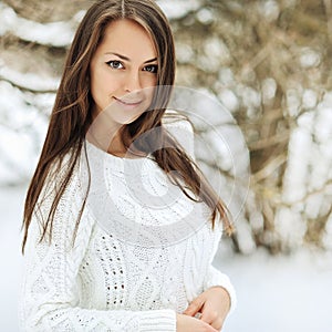 Outdoor portrait of a beautiful girl in wintertime