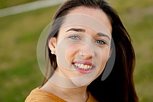 Outdoor portrait of beautiful happy teenager girl laughing