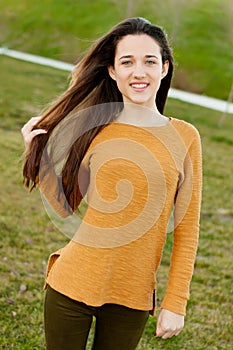 Outdoor portrait of beautiful happy teenager girl laughing