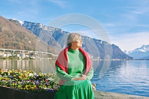 Outdoor portrait of beautiful mature woman with grey hair