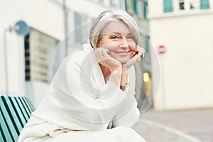 Outdoor portrait of beautiful middle age woman