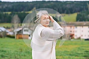 Outdoor portrait of beautiful middle age woman