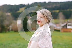 Outdoor portrait of beautiful middle age woman