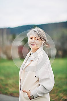 Outdoor portrait of beautiful middle age woman