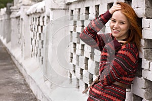 Outdoor portrait of beautiful redhair woman