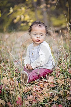 Outdoor Portrait of a beautiful serene mixed race little boy