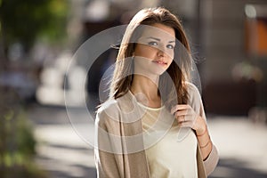 Outdoor portrait of beauty woman with perfect smile standing on the street