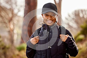 Outdoor, portrait and black woman hiking in nature for physical exercise, mental and emotional wellbeing. Hiker