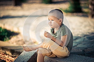 Outdoor portrait of cute little boy