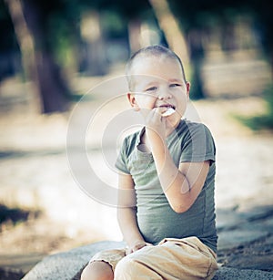 Outdoor portrait of cute little boy