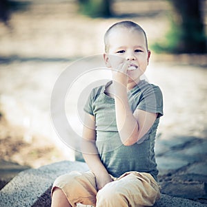 Outdoor portrait of cute little boy