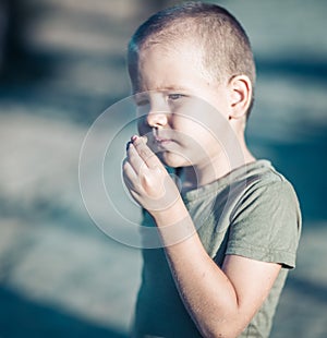 Outdoor portrait of cute little boy