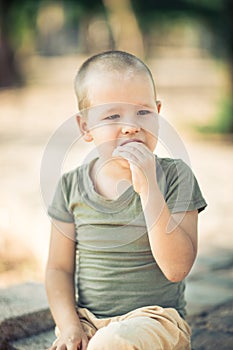 Outdoor portrait of cute little boy