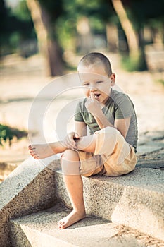 Outdoor portrait of cute little boy