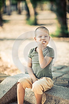 Outdoor portrait of cute little boy