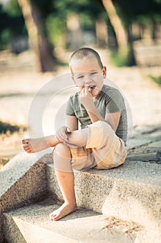 Outdoor portrait of cute little boy
