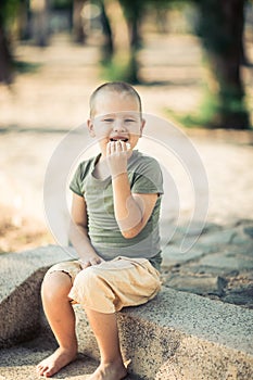 Outdoor portrait of cute little boy