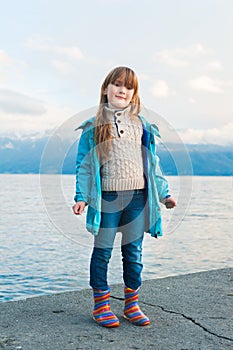 Outdoor portrait of a cute little girl photo