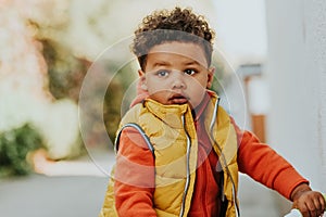 Outdoor portrait of cute little toddler boy