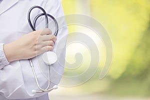 Outdoor Portrait Female Doctor Holding Stethoscope, Hospital worker standing