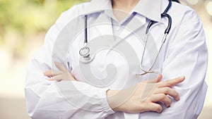 Outdoor Portrait Female Doctor Holding Stethoscope, Hospital worker standing