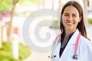 Outdoor Portrait Of Female Doctor photo