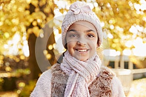 Outdoor Portrait Of Girl Wearing Hat And Scarf In Autumn