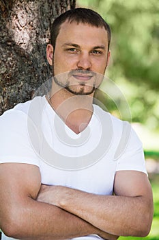 Outdoor portrait of a good looking young man