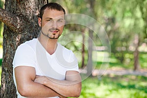 Outdoor portrait of a good looking young man