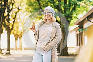 Outdoor portrait of happy cheerful middle age woman