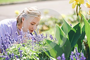 Outdoor portrait of happy and healthy mature 50 - 55 year old woman