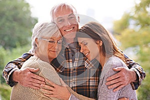 Outdoor, portrait and happy old man with family in nature, relax and smile from wife and daughter. Park, adult and male