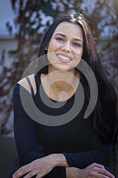 Outdoor portrait of a mediterranean, smiling woman