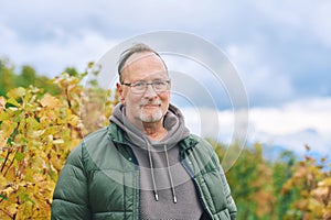 Outdoor portrait of middle age 55 - 60 year old man