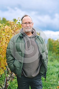 Outdoor portrait of middle age 55 - 60 year old man