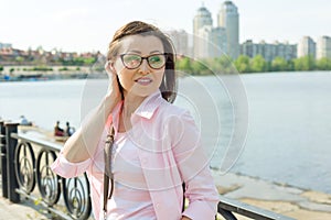 Outdoor portrait middle aged woman.