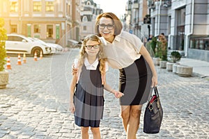 Outdoor portrait of parent and children on the way to school