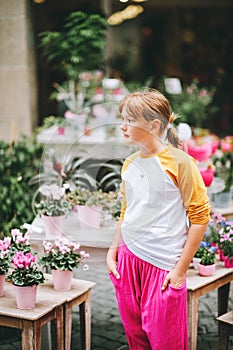 Outdoor portrait of pretty little teenage girl