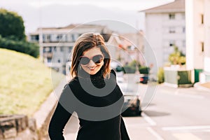 Outdoor portrait of pretty young woman