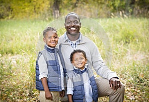 Outdoor Portrait of a Racially Diverse Father with his two sons