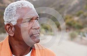 Outdoor Portrait Of Serious African American Senior Man With Mental Health Concerns