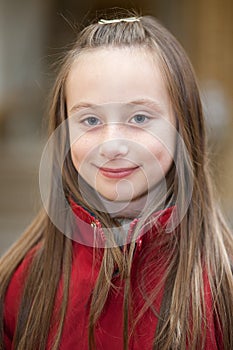 Outdoor portrait of a smiling girl