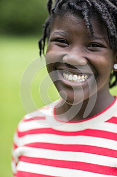 Outdoor Portrait Of Smiling Teenage Girl