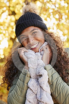 Outdoor Portrait Of Smiling Woman Wearing Scarf In Autumn