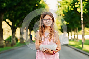 portrait of sweet little girl with a cast photo