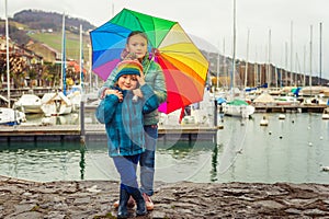 Outdoor portrait of two adorable kids